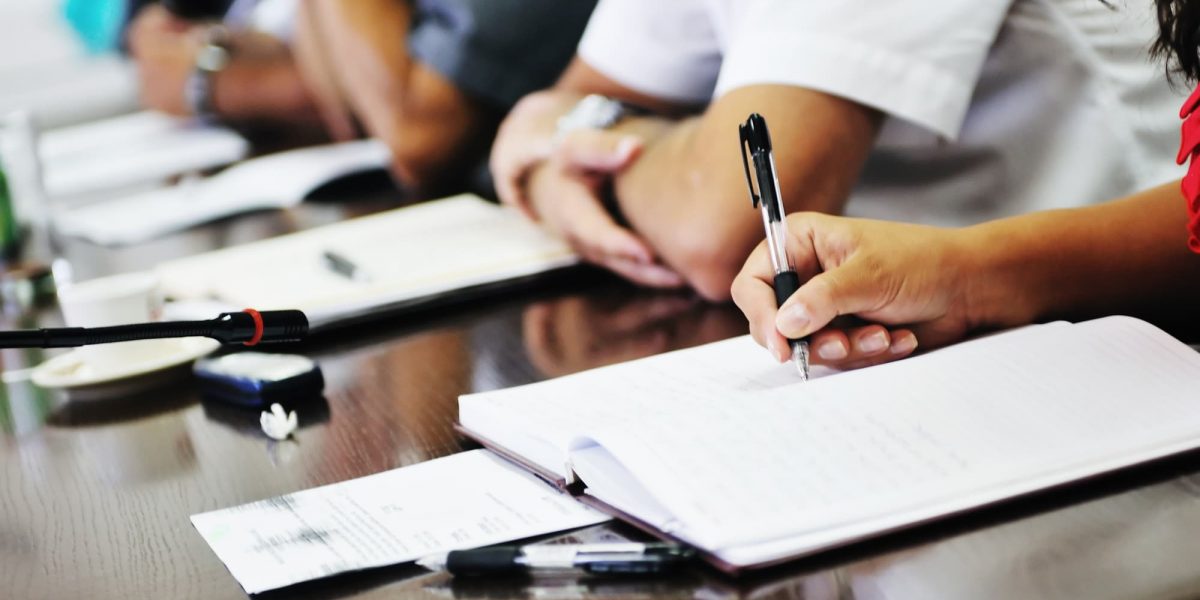 business beople on meeting conference taking notes and make deal